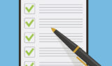 Clipboard check list marks with pen